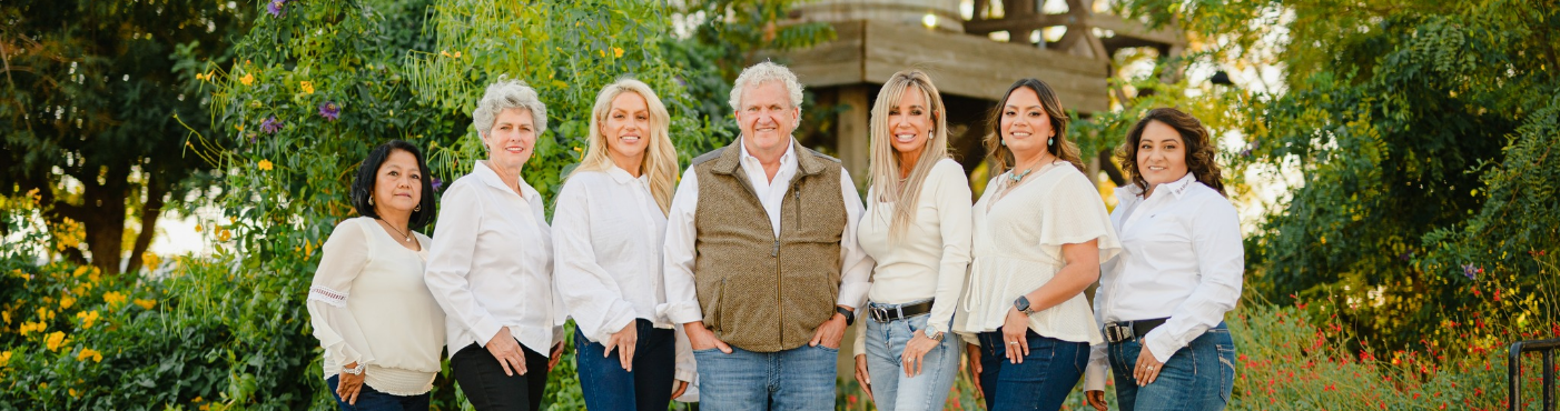 Odessa Dentist Dr. Steve Cobb & his team smiling for a photo