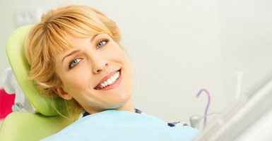 Smiling woman in dentist chair