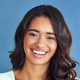 Dark haired young lady showing her big smile