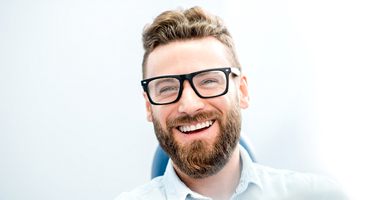 Male dental patient smiling after full mouth reconstruction in Odessa, TX