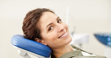 Female patient with brown hair leaning back in chair
