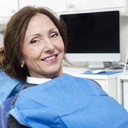 Woman smiling in dental chair during her checkup