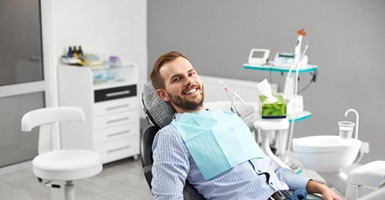 Male patient smiling after getting dental implant in Odessa, TX