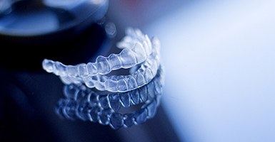 Close-up of two aligners for Invisalign in Odessa, TX