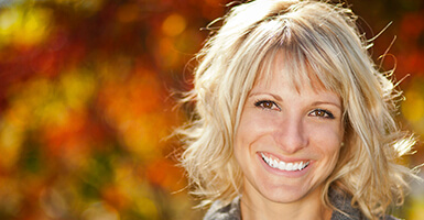 Blonde short haired woman smiling 