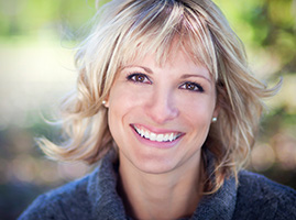 Smiling woman with a blue sweater