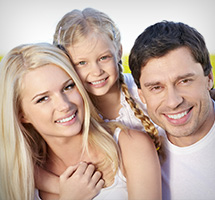 Parents and their little girl smiling