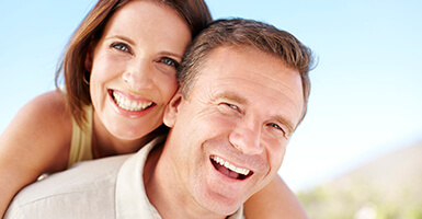 Couple showing off their snap-on smile