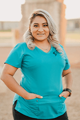 Woman with a blue shirt on smiling