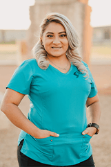 Woman with a blue shirt on smiling 