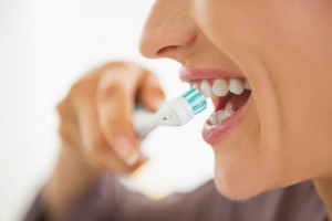 woman brushing teeth