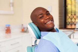 Man smiling after full mouth reconstruction in Odessa 