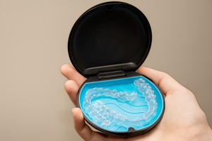Holding a case with two Invisalign aligners