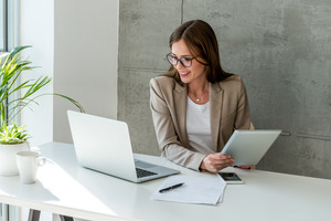 Woman sitting at a desk and smiling